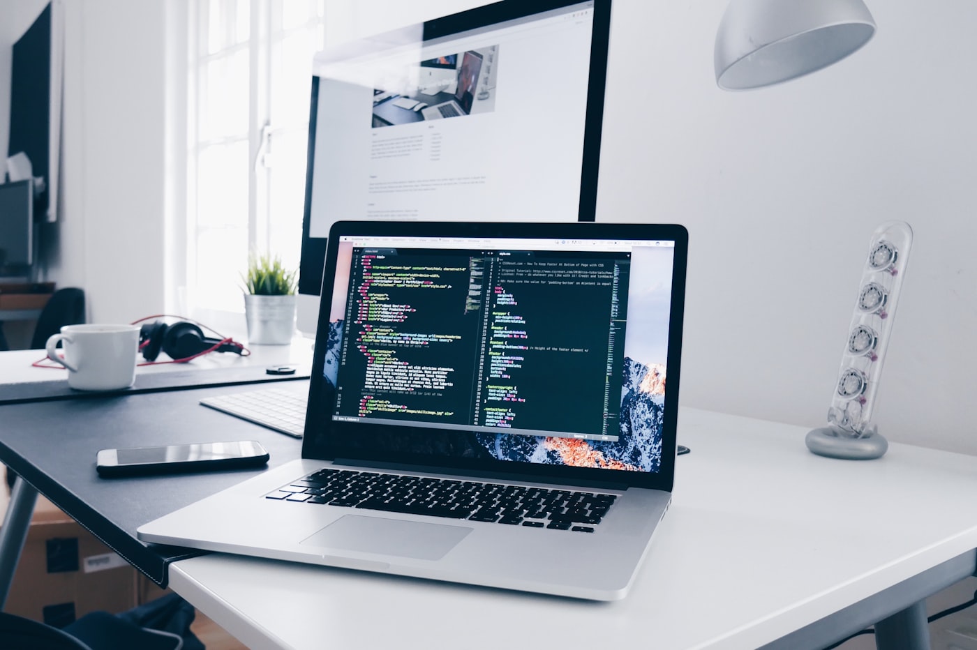 Laptop showing web development work